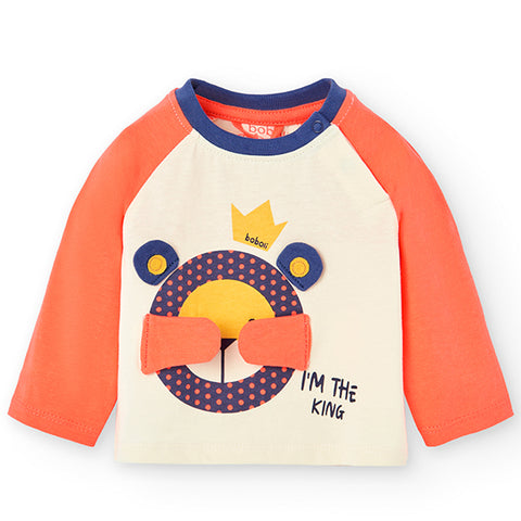 T-shirt bicolore con design di un leone e il testo 'I'M THE KING'.