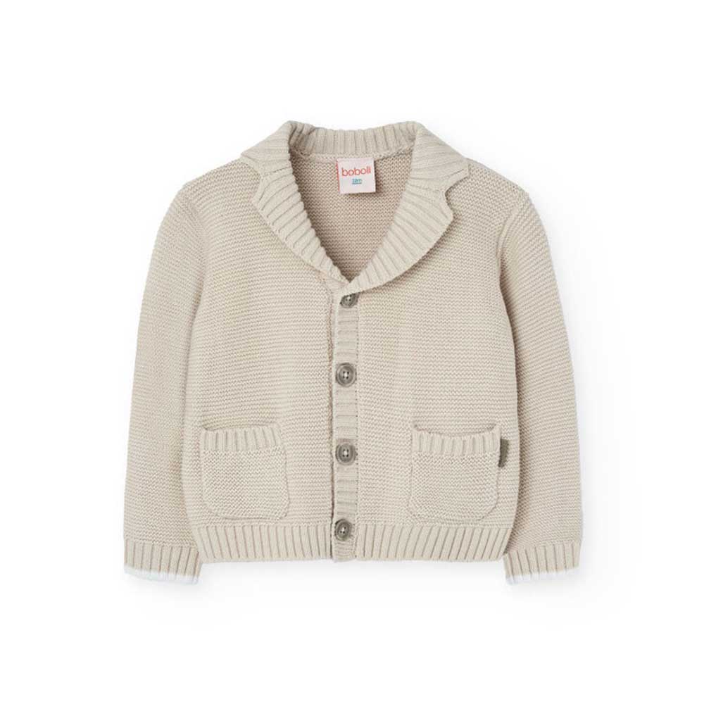 Cardigan aus der Kinderbekleidungslinie Boboli, mit Reverskragen und kleinen Taschen vorne.

Zusa...