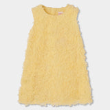 Abito giallo in tulle con fiori applicati, modello a trapezio per bambina.