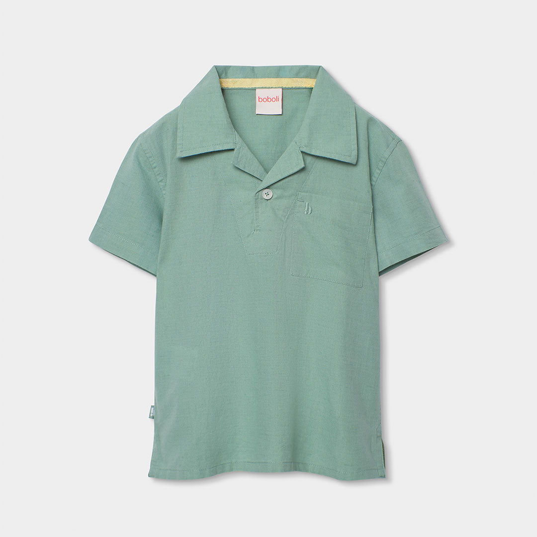Linen polo from the Children's Clothing Line Boboli, in solid color with a soft design.
Compositi...