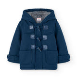 Giacca Montgomery con cappuccio per bambino, colore blu, tasconi sul davanti.
