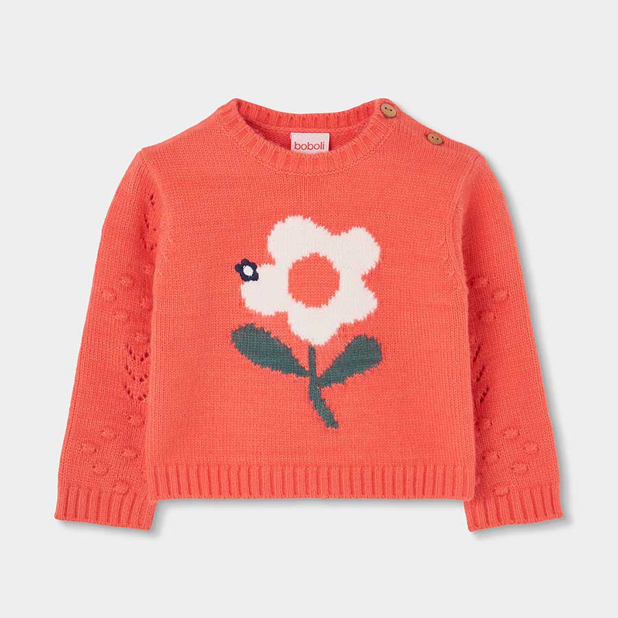 Hülle deine Kleine in einen Umarmung aus Farbe und Süße mit diesem Pullover, der mit einem großen...