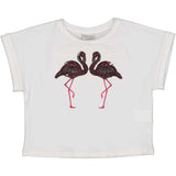 T-shirt cropped bianca con fenicotteri e paillettes per bambina.