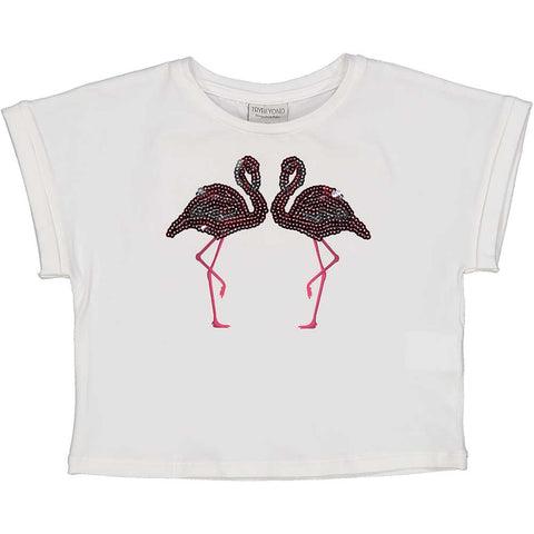 T-shirt cropped bianca con fenicotteri e paillettes per bambina.