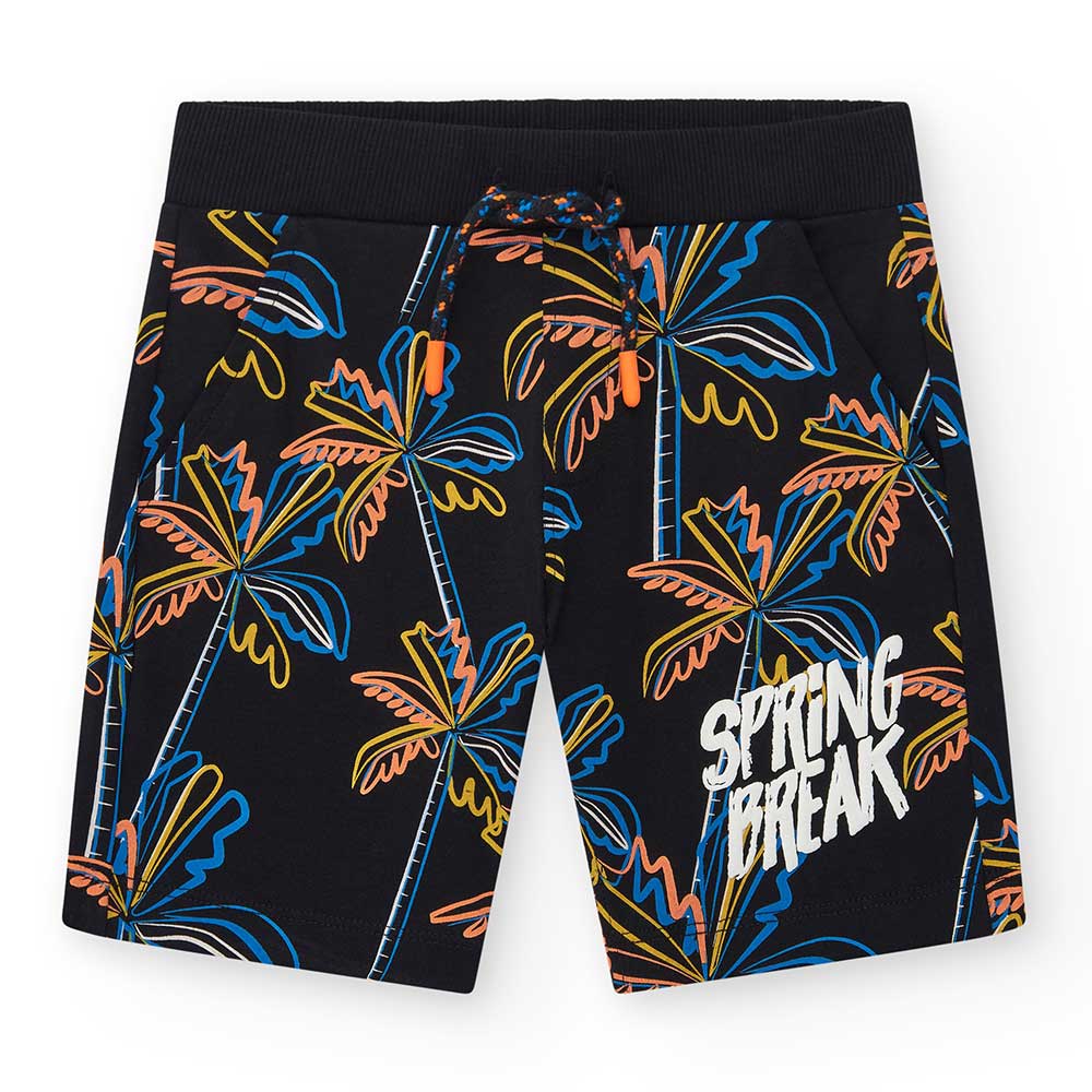 Bermudas der Kinderbekleidungslinie Nath Kids, mit buntem Muster auf schwarzem Hintergrund.
Zusam...