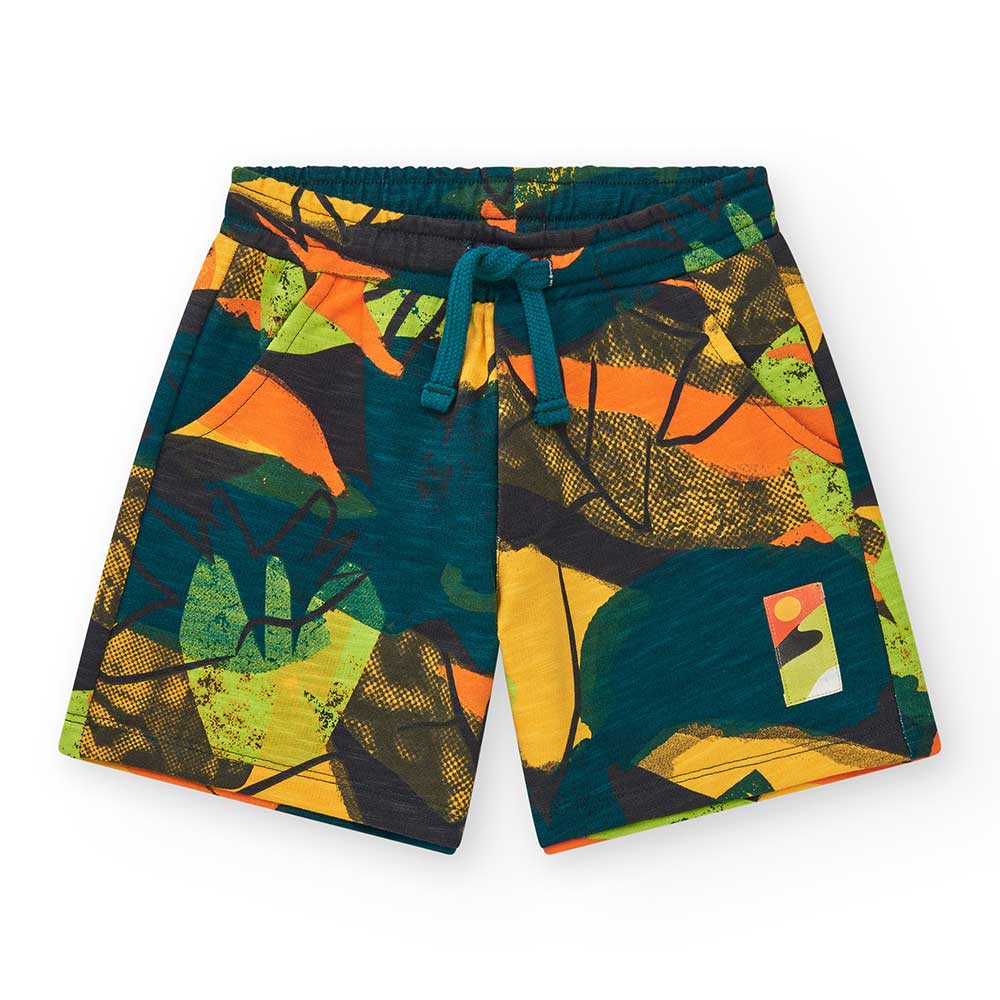 Bermuda aus der Kinderbekleidungslinie Nath Kids, mit camouflageartigem Muster in Neonfarben.
Zus...