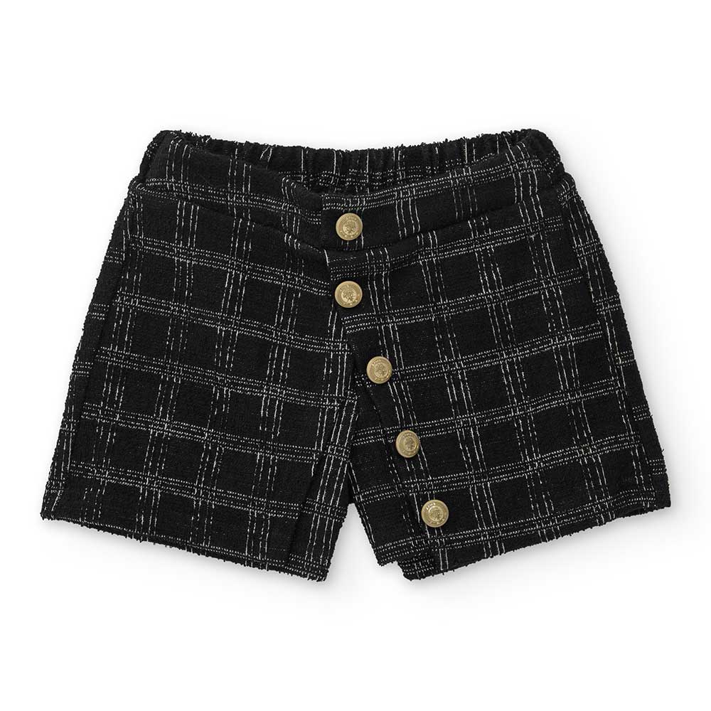 Top della Linea Abbigliamento Bambina Nath Kids, con taglio asimmetrico sulla spalla e fiocco app...