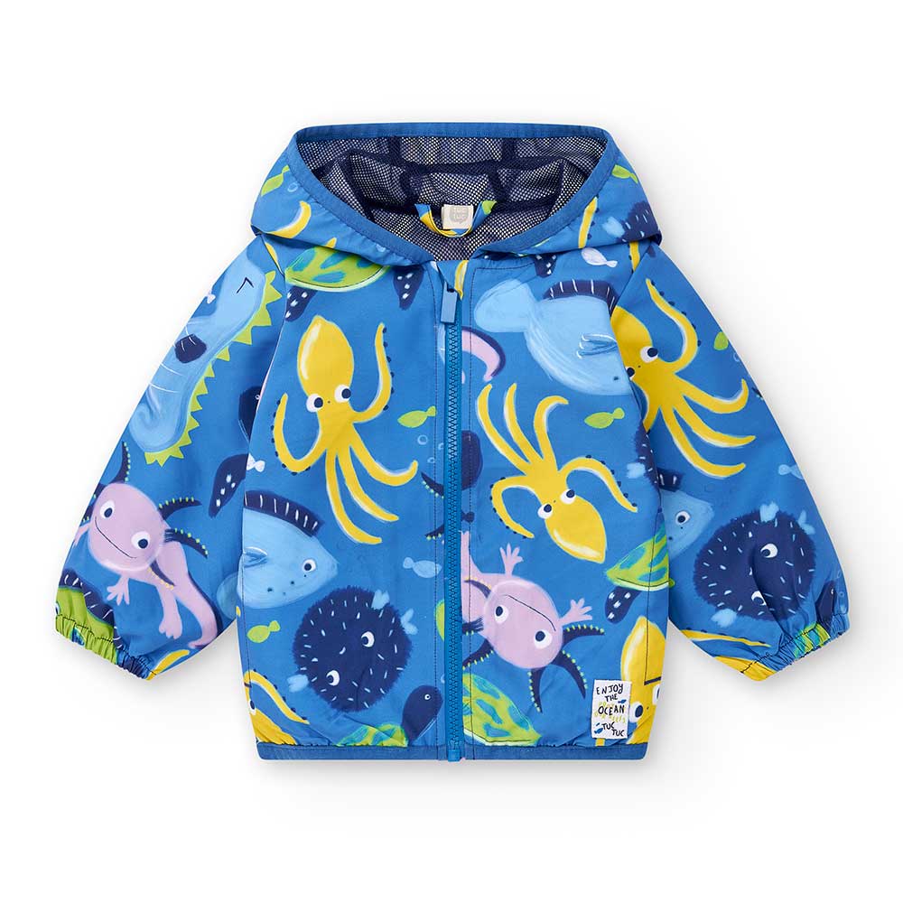 
Windjacke aus der Kinderbekleidungslinie Tuc Tuc, mit Kapuze und Netzfutter innen. Marine-Allove...