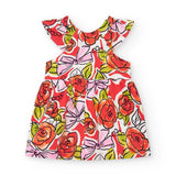 Abito floreale per bambina con ampia scollatura e dettagli colorati.