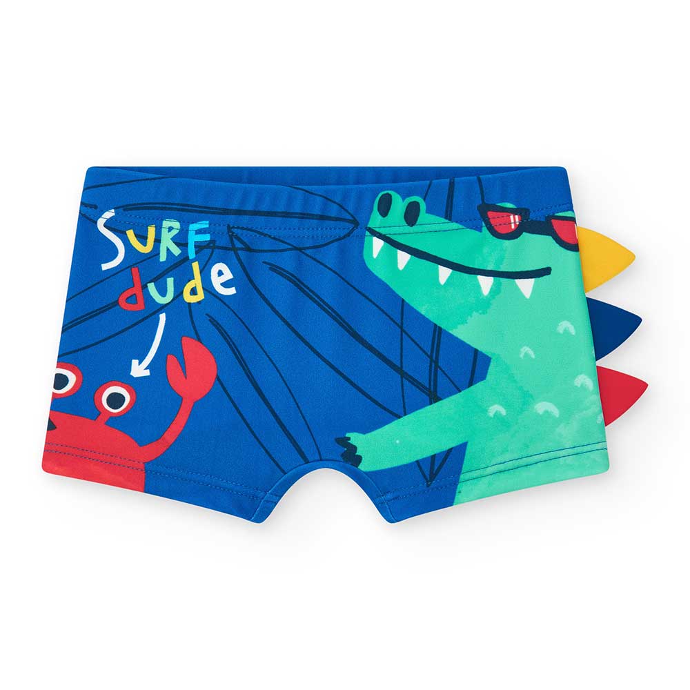 Strand-Boxershorts aus der Kinderbekleidungslinie Tuc Tuc, mit buntem Muster.

Zusammensetzung: P...