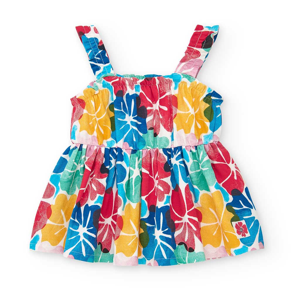 Kleidchen aus der Bekleidungslinie Tuc Tuc Bambina, mit mehrfarbigem Hibiskus-Muster.
Zusammenset...